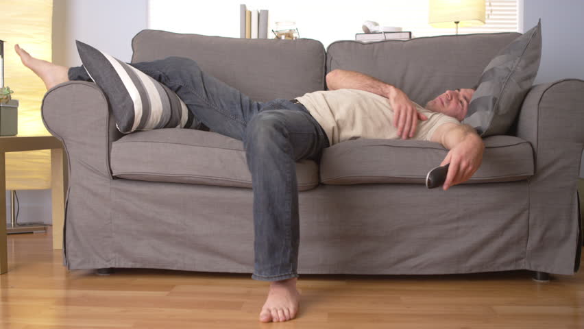 Man trying to sleep on couch | Shutterstock HD Video #6598763