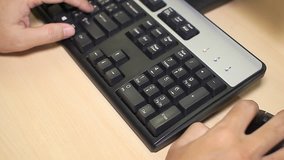 Man's hands on the keyboard