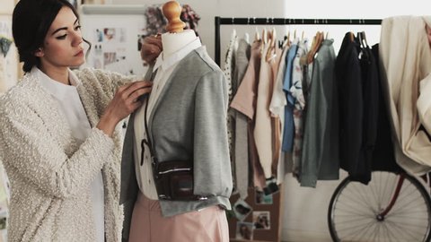 Fashion designer woman taking photograph for e-commerce online store