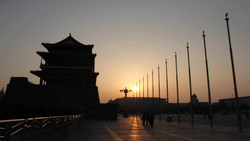 This is a time lapse video of Tiananmen Square in the evening showing the sun setting.