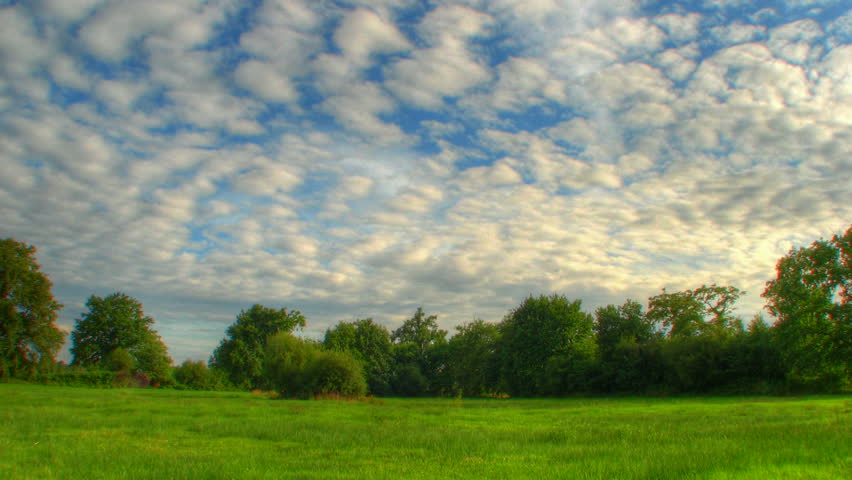 Blue sky over fields, HD time lapse clip, high dynamic range imaging