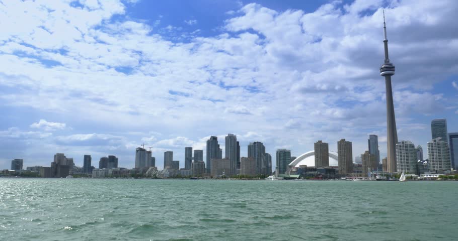 TORONTO, ONTARIO, CANADA - Circa June, 2014 - An establishing shot of Toronto, Canada as seen from a boat on Lake Ontario.
