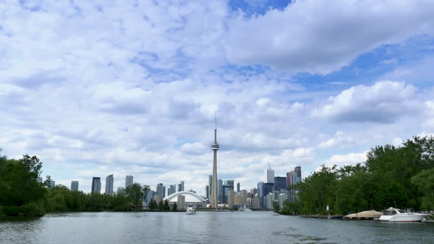 TORONTO, ONTARIO, CANADA - Circa June, 2014 - An establishing shot of Toronto, Canada as seen from a boat on Lake Ontario.
