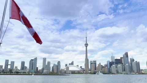 TORONTO, ONTARIO, CANADA - Circa June, 2014 - An establishing shot of Toronto, Canada as seen from a boat on Lake Ontario.
