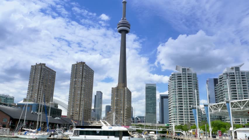 TORONTO, ONTARIO, CANADA - Circa June, 2014 - An establishing shot of Toronto, Canada as seen from a boat on Lake Ontario.