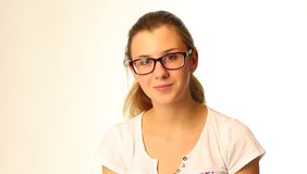 Beautiful teenager girl wearing glasses - isolated video