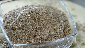 Portion of Flaxseeds in a bowl as not loopable full HD close-up video
