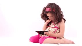 Boy playing with tablet against white background