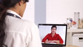 Elderly patient video chatting with doctor