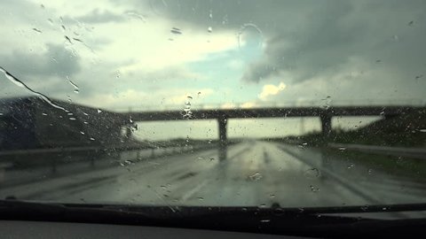Ultra HD 4K Driver Driving Car in Rain, Road, Stormy on Windshield, Traffic View