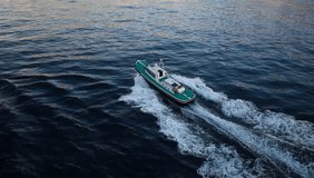 High Angle of View of a fast boat in the middle of the Ocean with beautiful waves running behind the heck (hd, 1920x1080, high definition, 1080p)