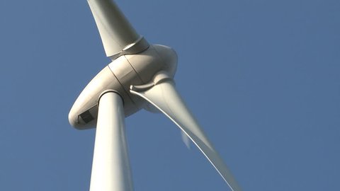 Wind power turbine on blue sky
