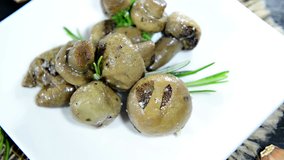 Portion of grilled Mushrooms (not loopable) as detailed full HD video file
