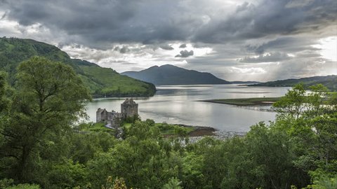 Slow zoom time lapse of dramatic sky over Loch Duich and Eilean Donan Castle, Dornie, Highlands, Scotland