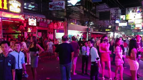 THAILAND, PATTAYA, MARCH 31, 2014: Walking Street is red-light district with many restaurants, go-go bars and brothels, that draws people, primarily for night life and sexual entertainments
