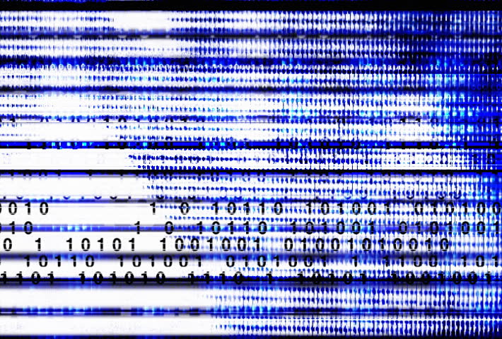 Rapidly changing stock board with blue binary code.