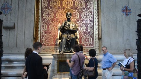 VATICAN, VATICAN, JUNE 2, 2014: People are queuing and touching foot of Saint Peter inside basilica called after him in Vatican.