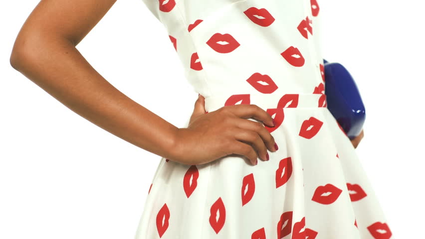 African girl wearing a pin-up dress and handbag in shape of lips 