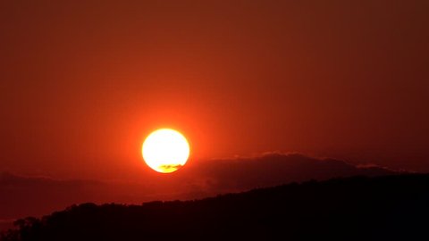 ULTRA HD 4K Timelapse of sunset or sunrise, beautiful sun down among the clouds, orange sky in summer day