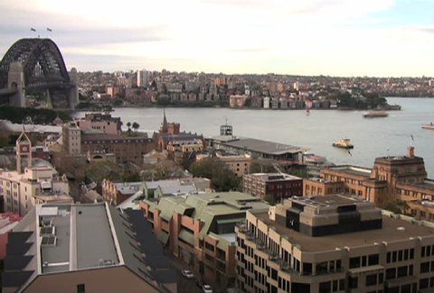 Aerial time lapse of boats passing through Sydney Harbor and Circular Quay