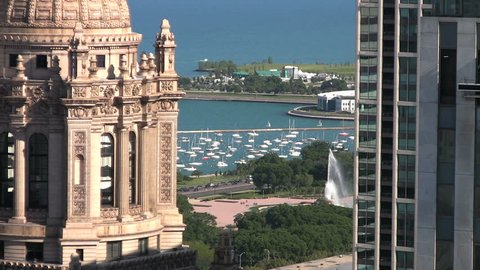 Aerial view of the downtown Chicago lakefront through downtown buildings.  Featuring Buckingham Fountain, Grant Park, Lake Shore Drive, and Museum Campus.