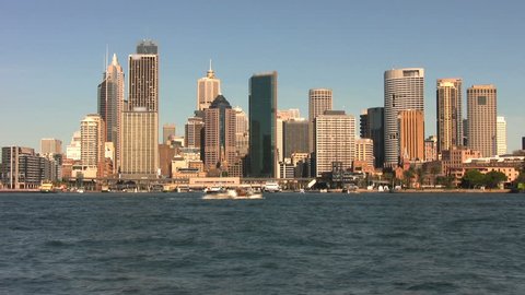 Time lapse view of boats passing through Circular Quay and Sydney Harbor with the skyline behind