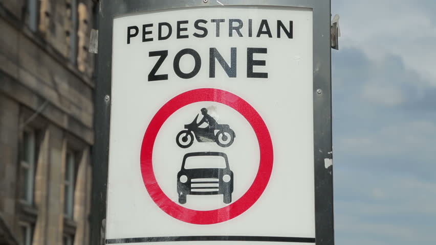 EDINBURGH, SCOTLAND - JUNE 03, 2014: Pedestrian zone sign in The Royal Mile. Parts of the Royal Mile, or High Street, are now pedestrianised.