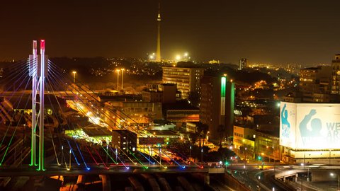 Johannesburg, Gauteng, South Africa - 25/07/2013.  A colourful display of nighttime traffic crossing the Nelson Mandela Bridge in the city centre of Johannesburg.