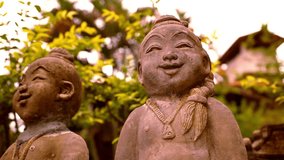 Smiling Buddha sculpture, Thailand. Video macro shift motion