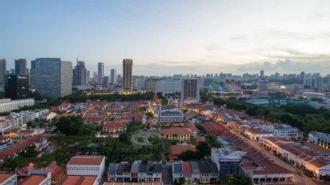 Time lapse movie of sunset to blue hour over Kampong Glam with Singapore Urban cityscape. Kampong Glam is a Malay village where the Sultan Mosque and Malay Heritage Center are located 1920x1080