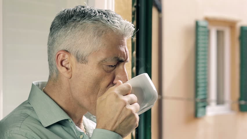 Drinking steaming coffee at the window: old man, thoughts, thinking, gaze, out | Shutterstock HD Video #6706438