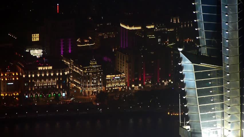 Elevated view of high-rise buildings rooftop crown with river at night in Shanghai,China.Jin Mao Tower(one of China