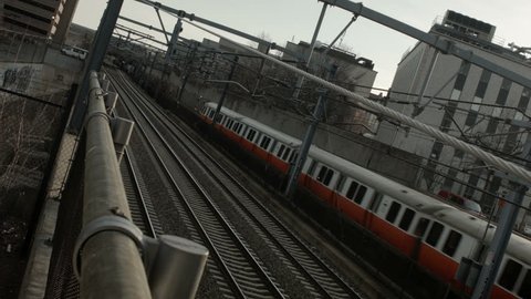 boston orange line train enters station dutch angle