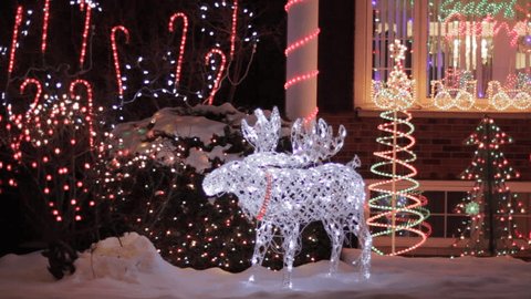 North American Houses Brightly Light With Christmas Lights And Decorations At Night Stock Video