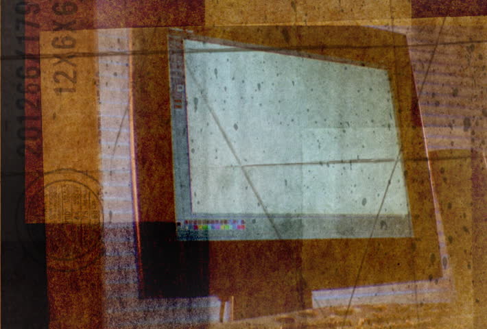 Textured image of rotating flat screen monitor and keyboard.