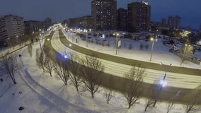 RUSSIA, SAMARA - JAN 8, 2014: Tram rides by street at winter night in snowbound city. Aerial view - Powered by Shutterstock - Get 15% off with code: PIKWIZARD15