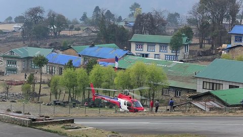 LUKLA, NEPAL - APRIL 2: Tenzing-Hillary Helicopter takes off from the most dangerous airport in the world on April 2, 2014 in Lukla, Nepal. Full HD
