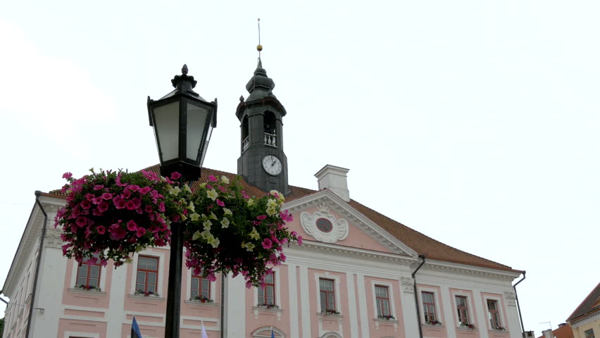 A view of the old town hall from Tartu Estonia with people passing through GH4 4K