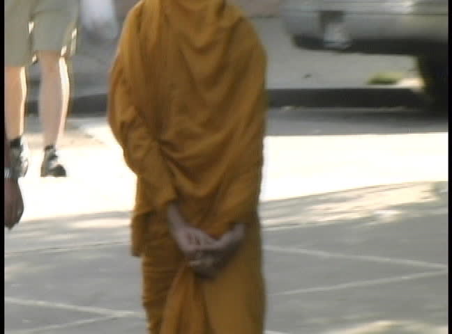 A monk walking on the street, NTSC