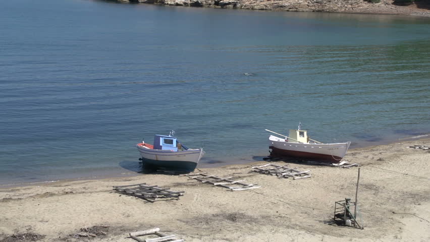 Fishing boats at the beach in skala marion Thassos Greece