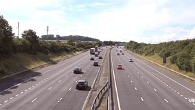 STAFFORD, MIDLANDS - JULY 2014: Aerial view southbound of UK traffic, M6 Motorway Between Junction 13 and 14, Stafford. Free flowing motorway traffic running smoothly - 4k 3840x2160 scenic background