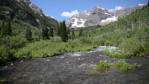 Maroon Bells and moving stream, Elk Mountains, Colorado, HD Video with Sound