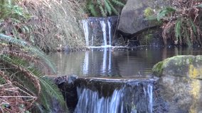 Rocky Waterfall - 2 - Close Water & Stones - Close up on falling water stream and pond surface of cascade waterfall at spring mountain forest, park or garden...