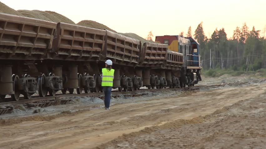 Woman walking along train