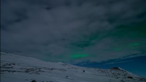 single woman walking on a mountain side with northern lights (aurora borealis) 4K resolution - Powered by Shutterstock - Get 15% off with code: PIKWIZARD15