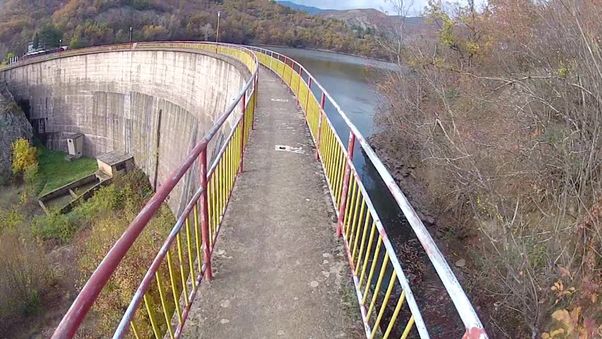 bicycle drive pov on dam crown narrow path
