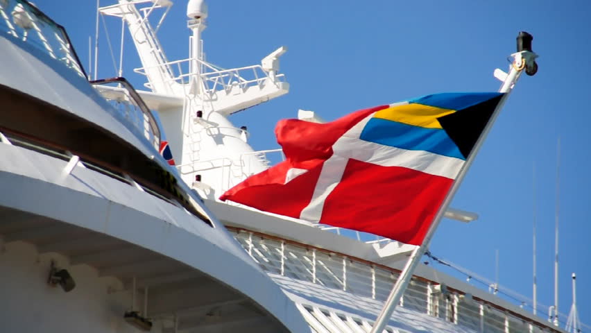 The Bahamas flag flies on the aft of a cruise ship in Nassau.