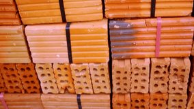 Closeup of Stack Of Raw Bricks. Macro video shift up motion