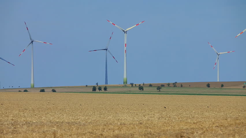 Wind power plants on blue sky background  