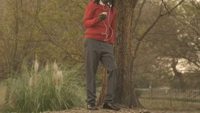 young African American man using cell phone for video calling 